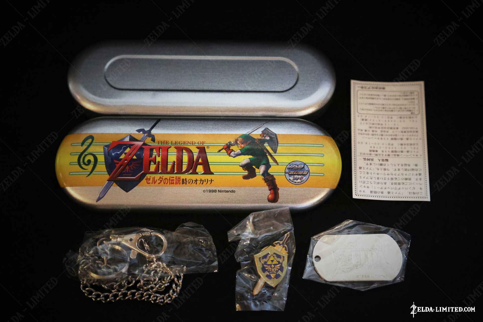 metal box that includes a pin and tag