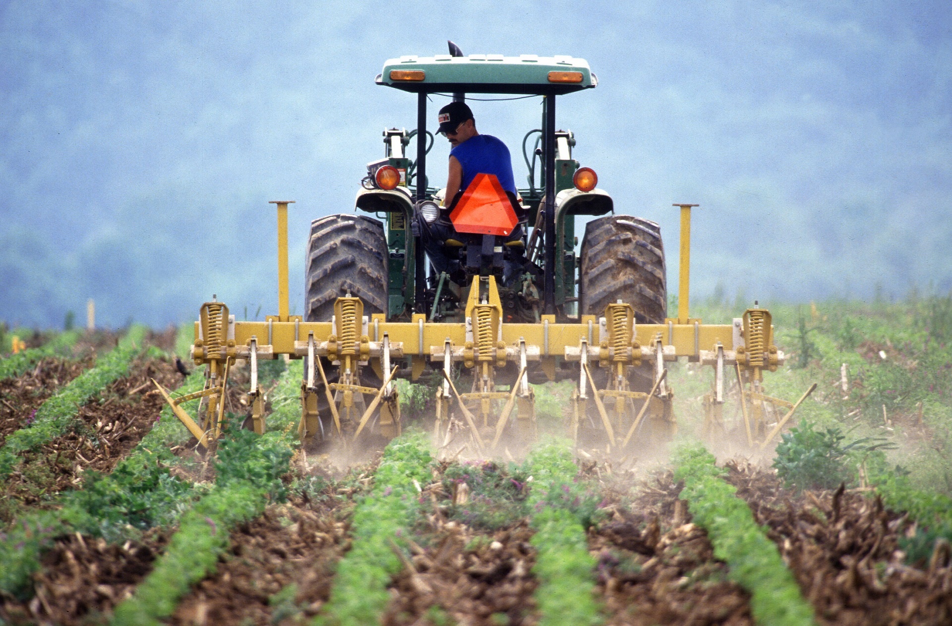 Farmer on a tractor working