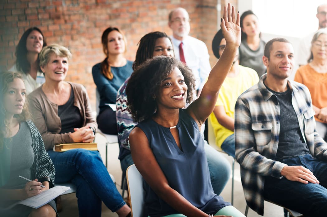 woman raising hand