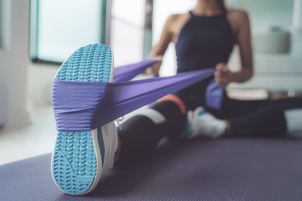 woman using resistance band