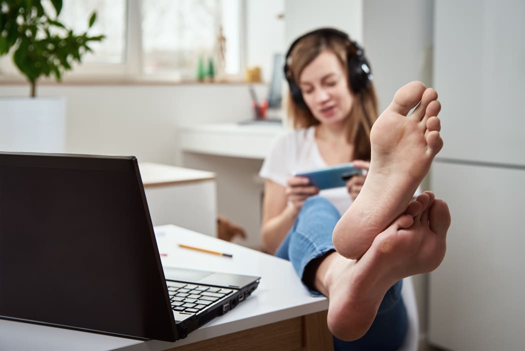 woman with feet on desk