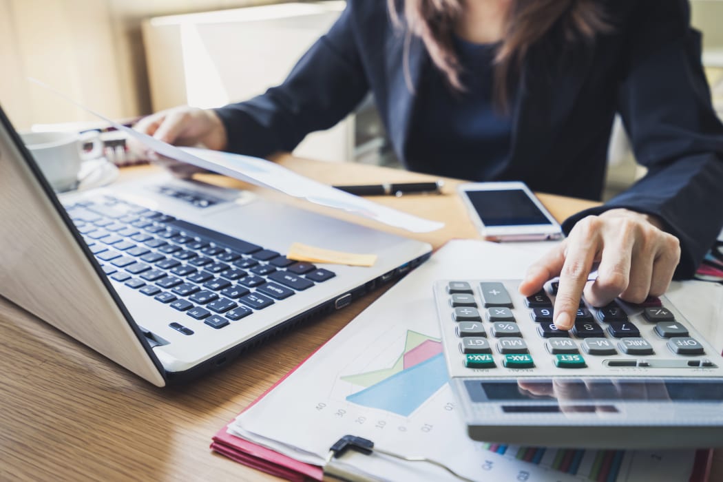 accountant using calculator