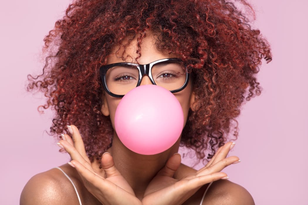 woman blowing bubble