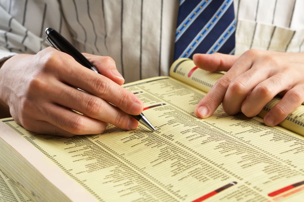 businessman searching yellow pages