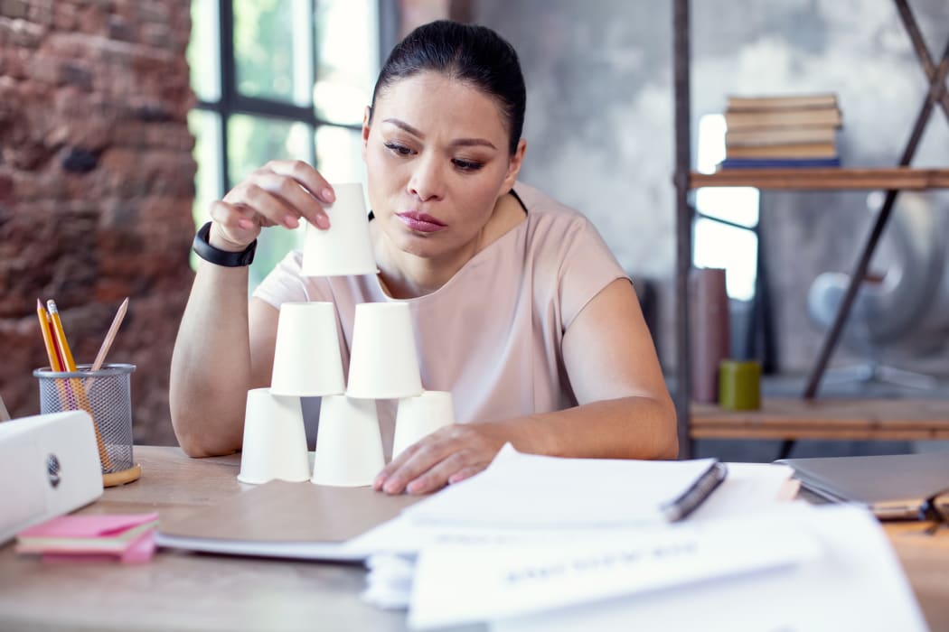 woman stacking cups