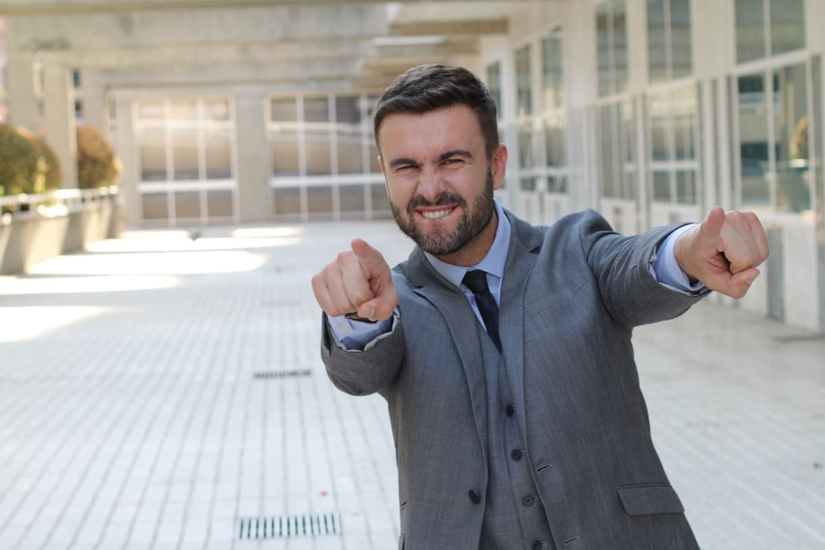 man pointing at camera