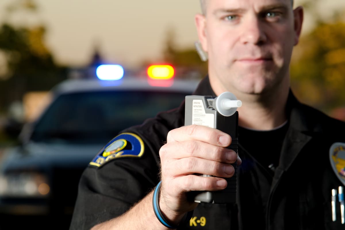 officer with breathalyzer