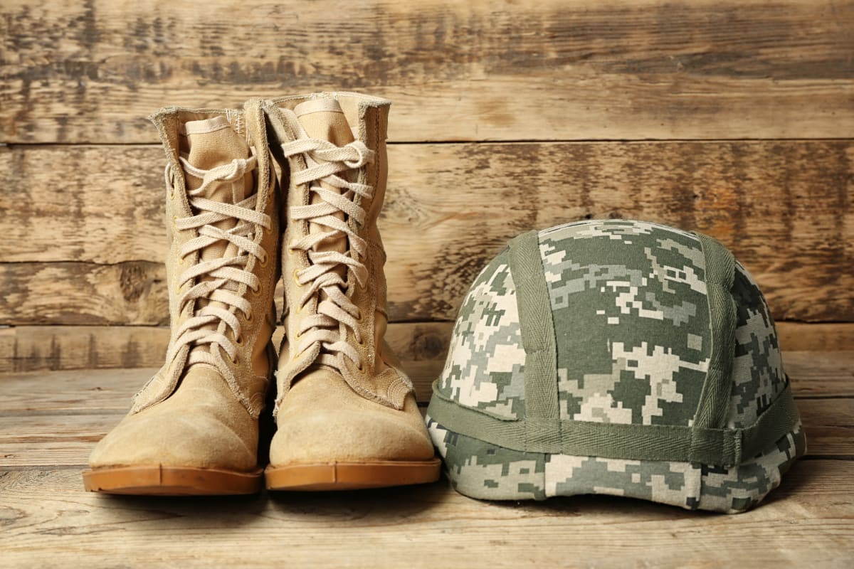 combat boots and helmet