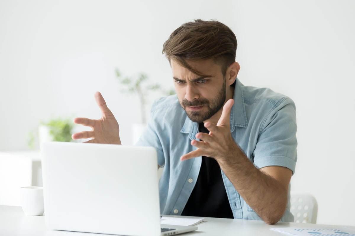 frustrated man at laptop