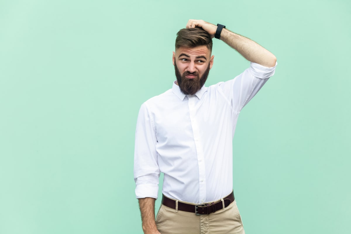 man scratching head