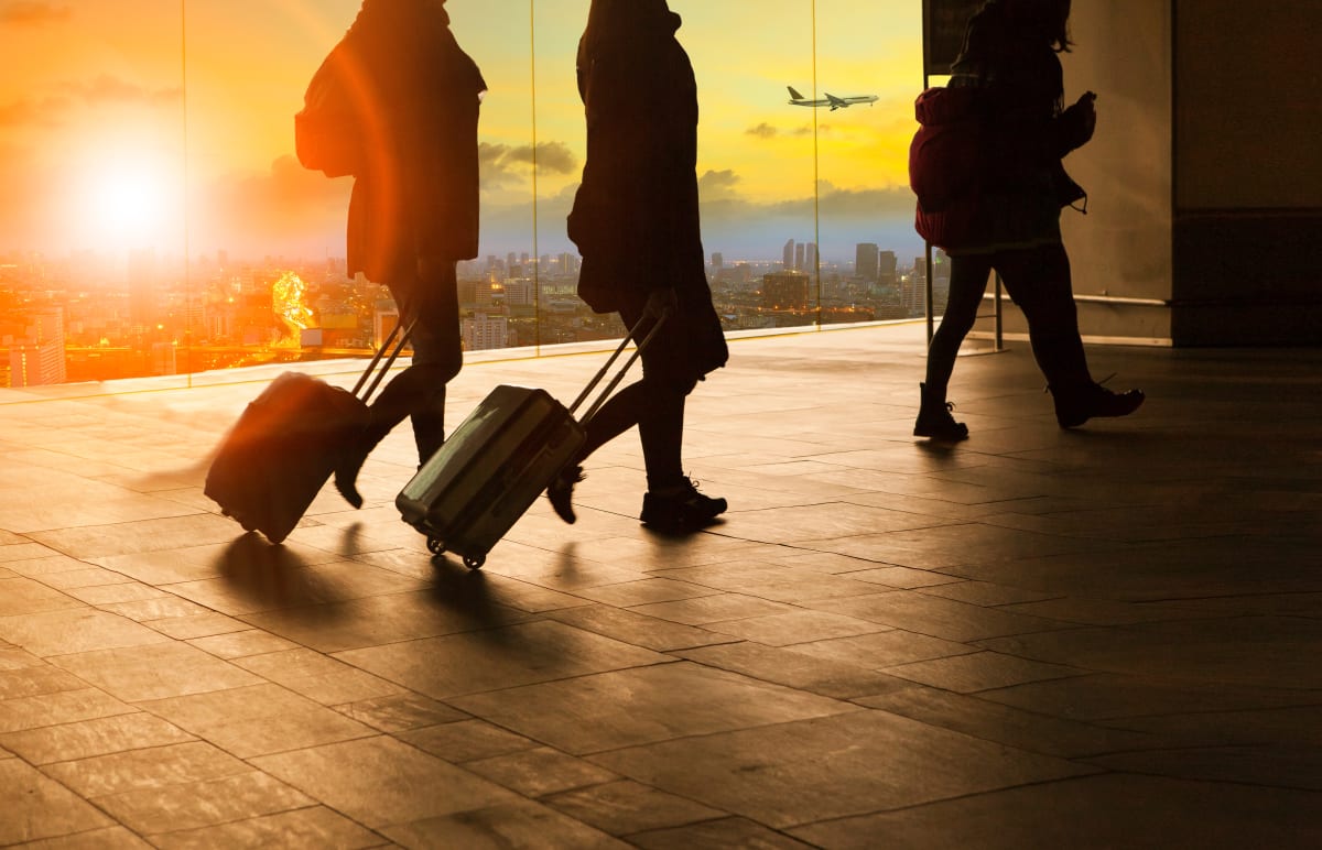 people pulling suitcases