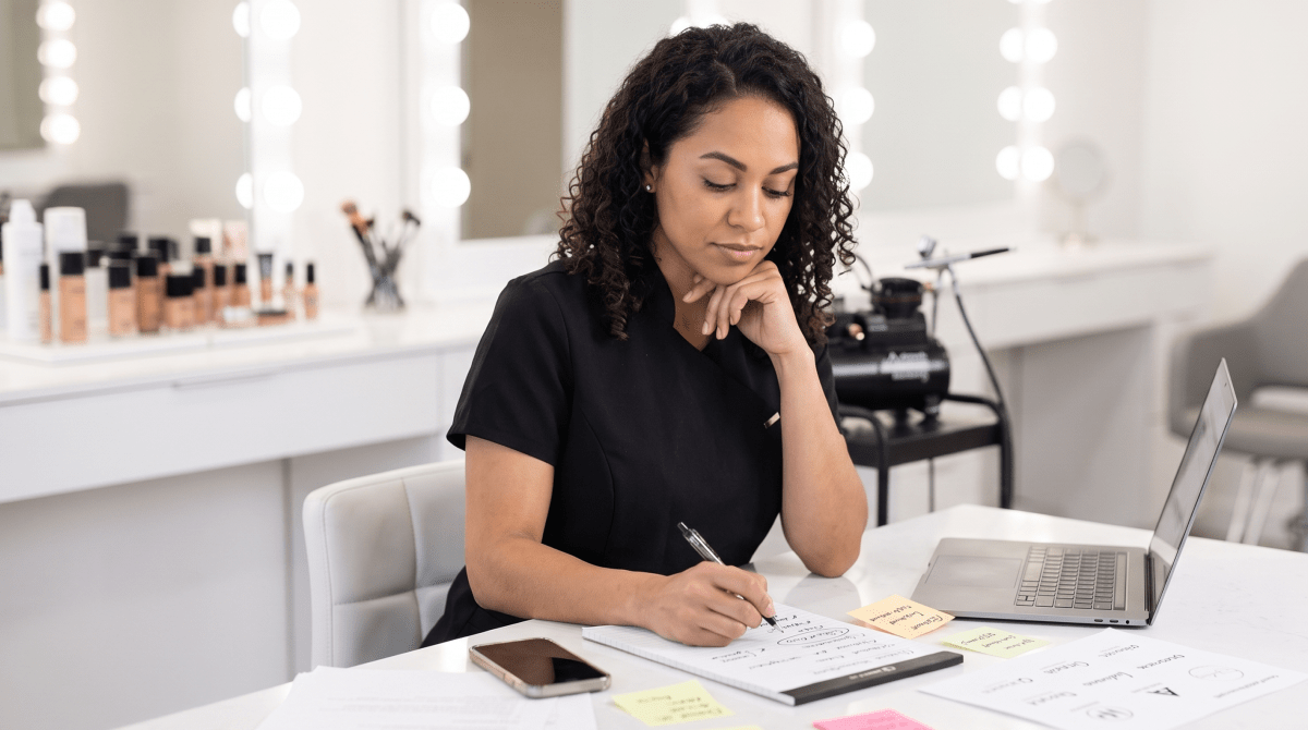 Airbrush makeup artist owner brainstorming business name ideas