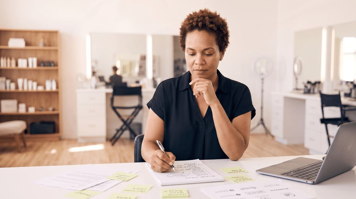 Makeup artist school owner brainstorming business name ideas
