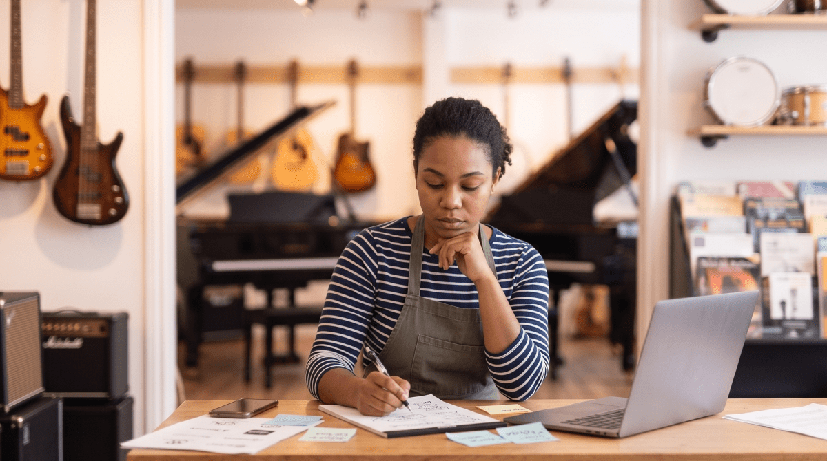 Music instrument store owner brainstorming business name ideas