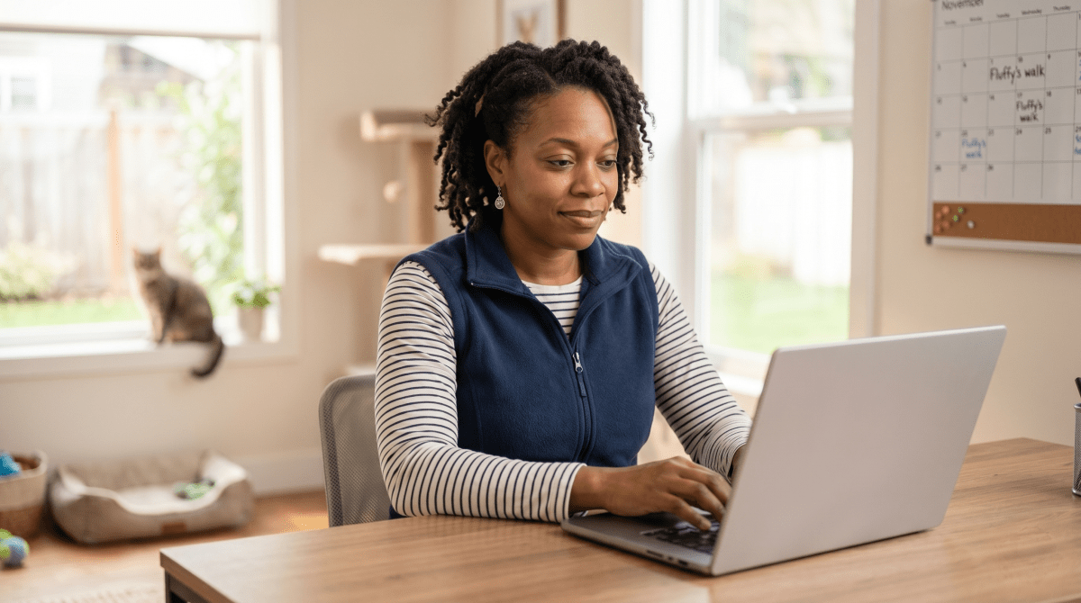 Pet sitter registering a pet sitting business as an LLC on a laptop