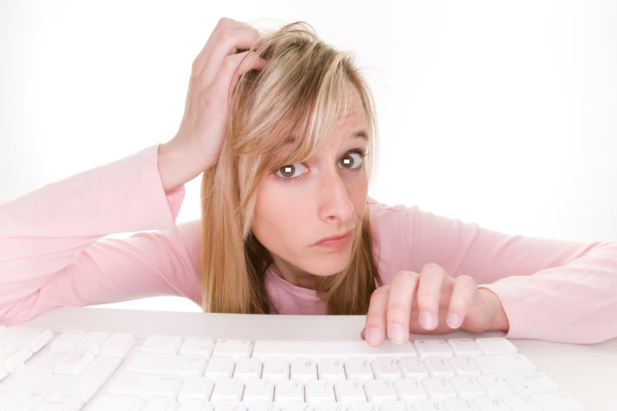 woman scratching head