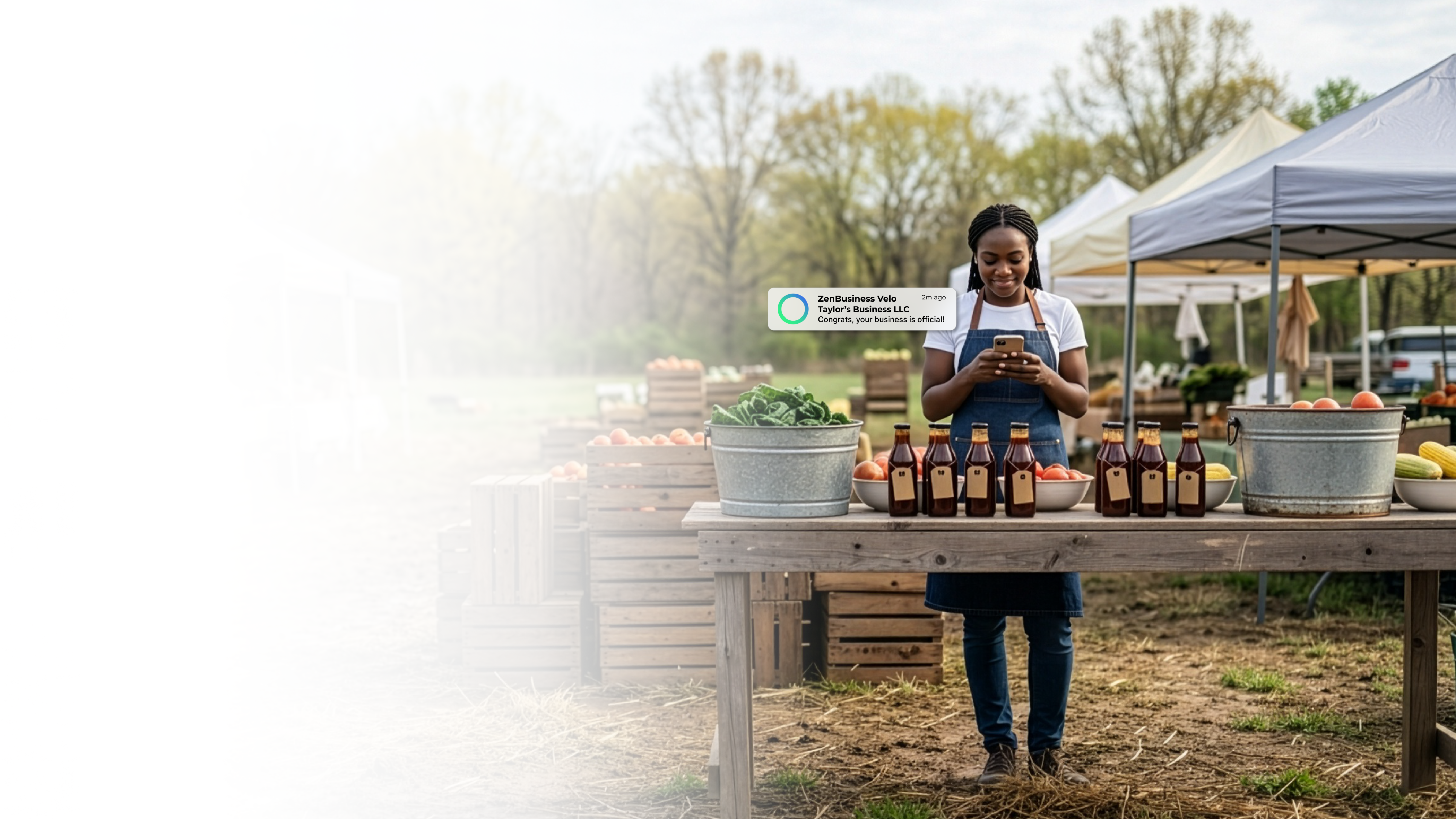 Female market vendor at a Kentucky outdoor farmers market stand with fresh produce checking her ZenBusiness Velo notification showing her LLC is approved