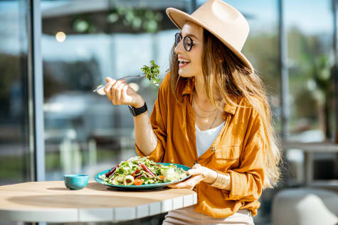 Woman eating at a uniquely named resturant