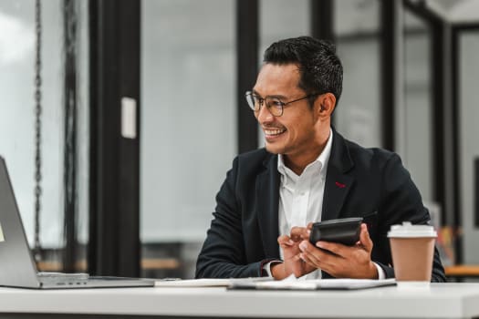 businessman calculating cost