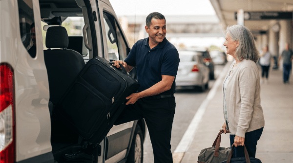 Airport shuttle service driver transporting passengers to and from the airport