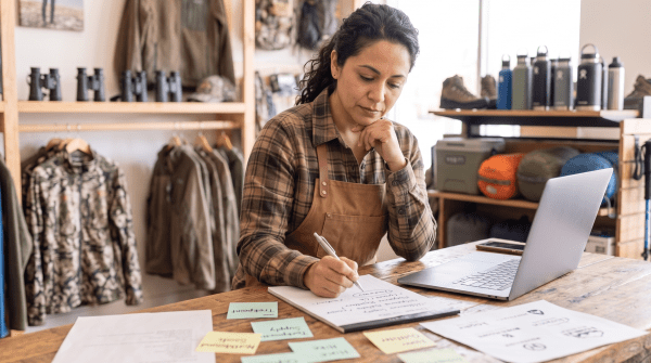 Hunting and outdoor store owner brainstorming business name ideas