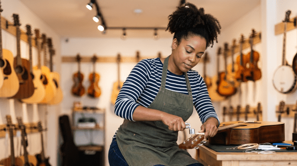 Music instrument store owner running a music instrument store