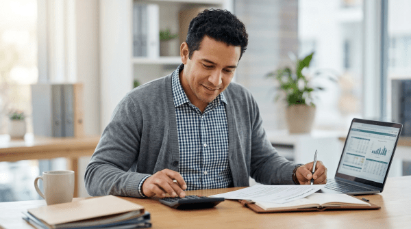 Rental property investor and business owner reviewing buy-and-hold investment property details