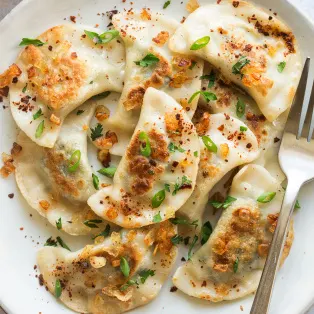 Vegetarian Potato and Cheese Pierogi and Salad Vegetarian Potato and Cheese Pierogi and Salad