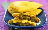 Jamacian Curry Chicken Patty with Fried Plantains and Sauteed Kale