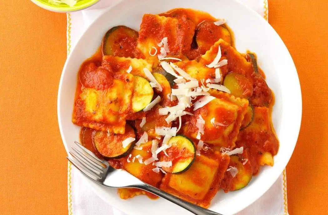 Ricotta Ravioli in Rosso Tomato Cream Sauce with Garlic Bread and Mista Salad