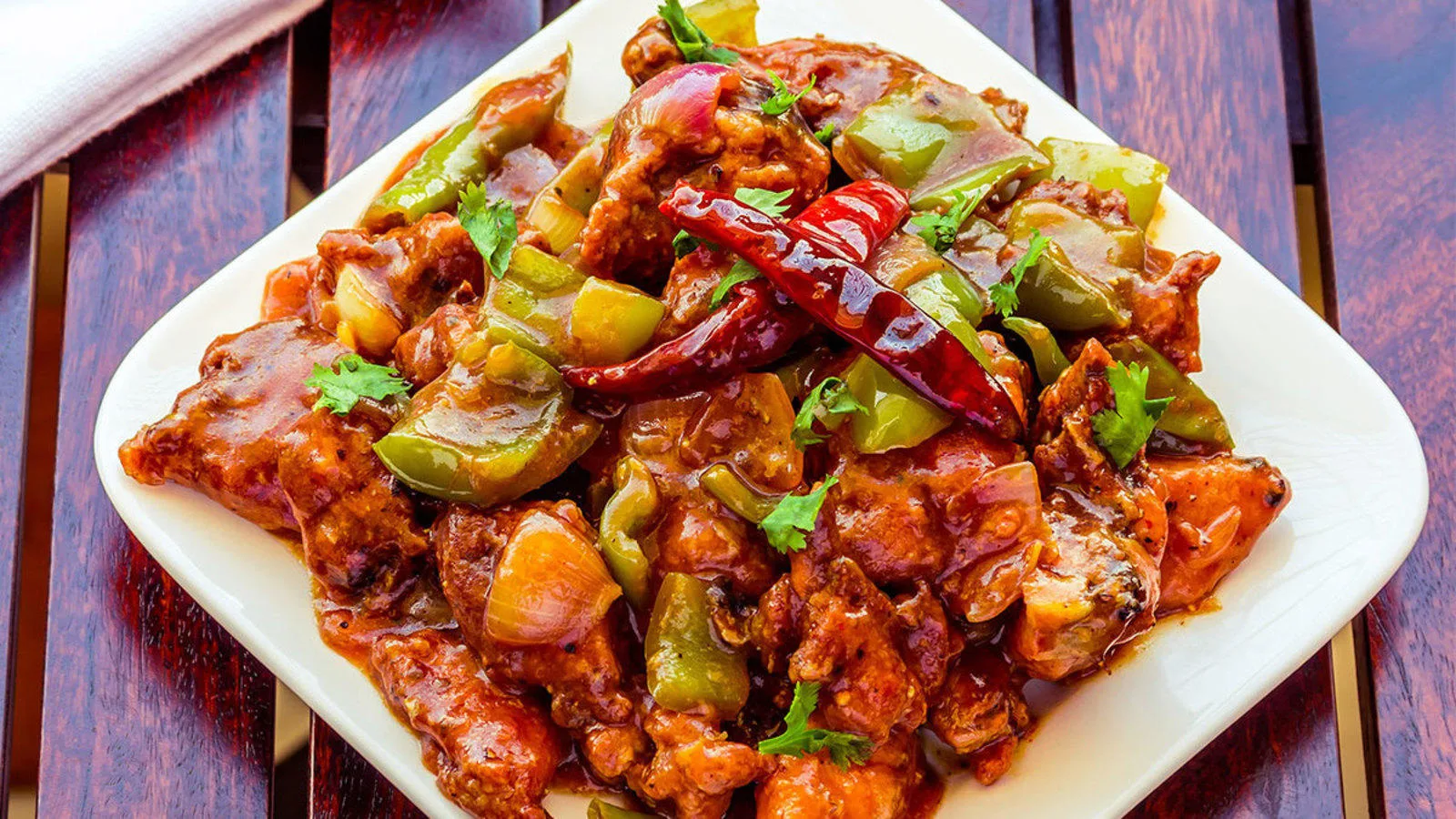 Himalayan Chili Chicken served with Achari Gobi and Saffron Rice