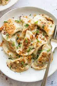 Spinach & Feta Pierogi Lunchbox with Sauerkraut and Mustard Sauce Spinach & Feta Pierogi Lunchbox with Sauerkraut and Mustard Sauce