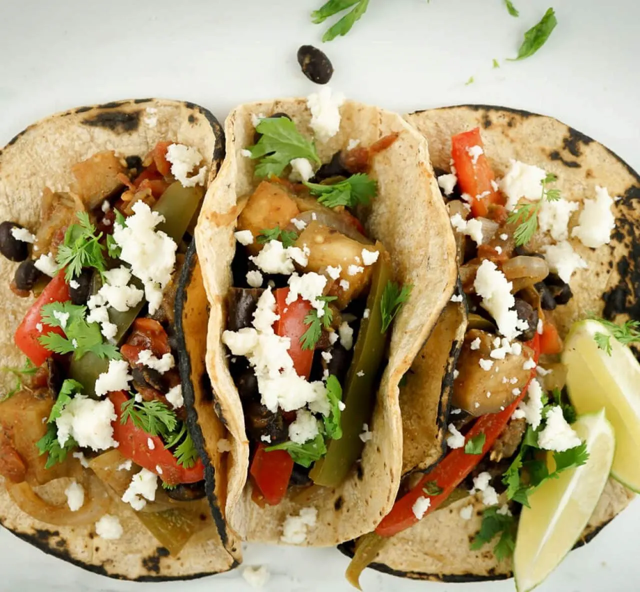 Eggplant Fajitas with Corn Tortilla, Yellow Rice & Black Beans (Sour Cream, Salsa) Eggplant Fajitas with Corn Tortilla, Yellow Rice & Black Beans (Sour Cream, Salsa)