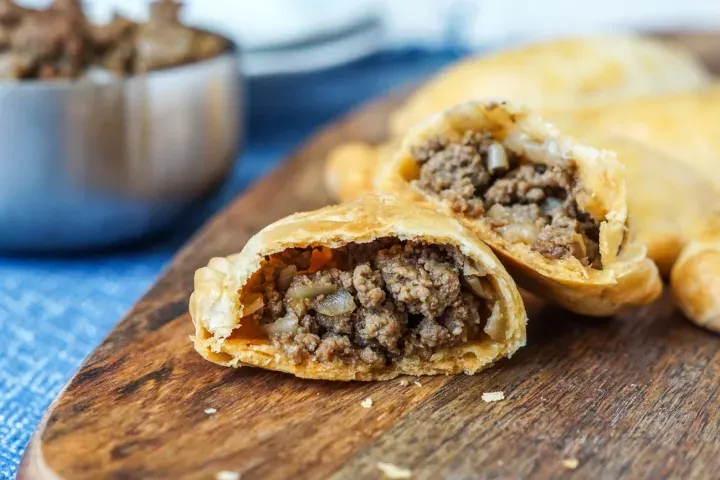 Two Carne Sauve Empanadas with Mediterranean Quinoa & Kale Salad (Mild) Two Carne Sauve Empanadas with Mediterranean Quinoa & Kale Salad (Mild)