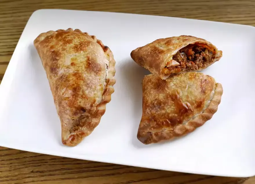 Two Parisien Empanadas with Mixed Green Salad Two Parisien Empanadas with Mixed Green Salad