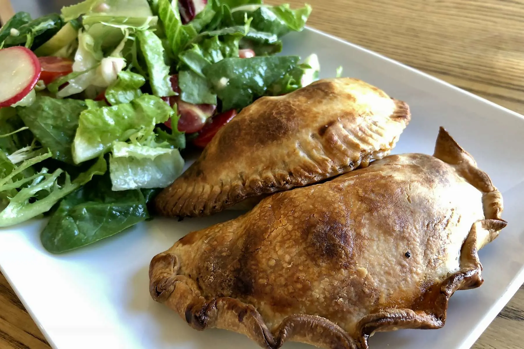 Two Traditional Empanadas with Mixed Green Salad (A bit of spice) Two Traditional Empanadas with Mixed Green Salad (A bit of spice)