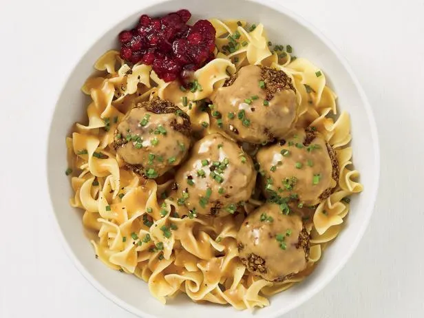 Swedish meatballs over egg noodles served with lingonberry compote