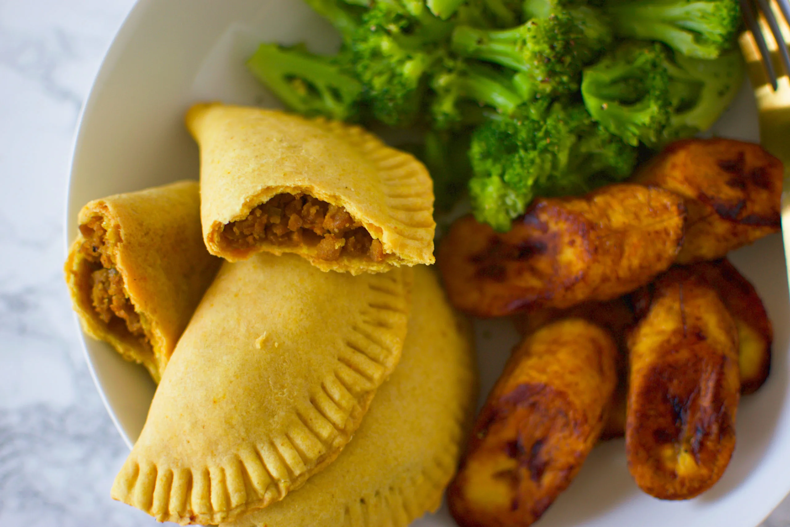 Jamacian Beef Patty with Bell Peppers and Onions with Sauteed Kale