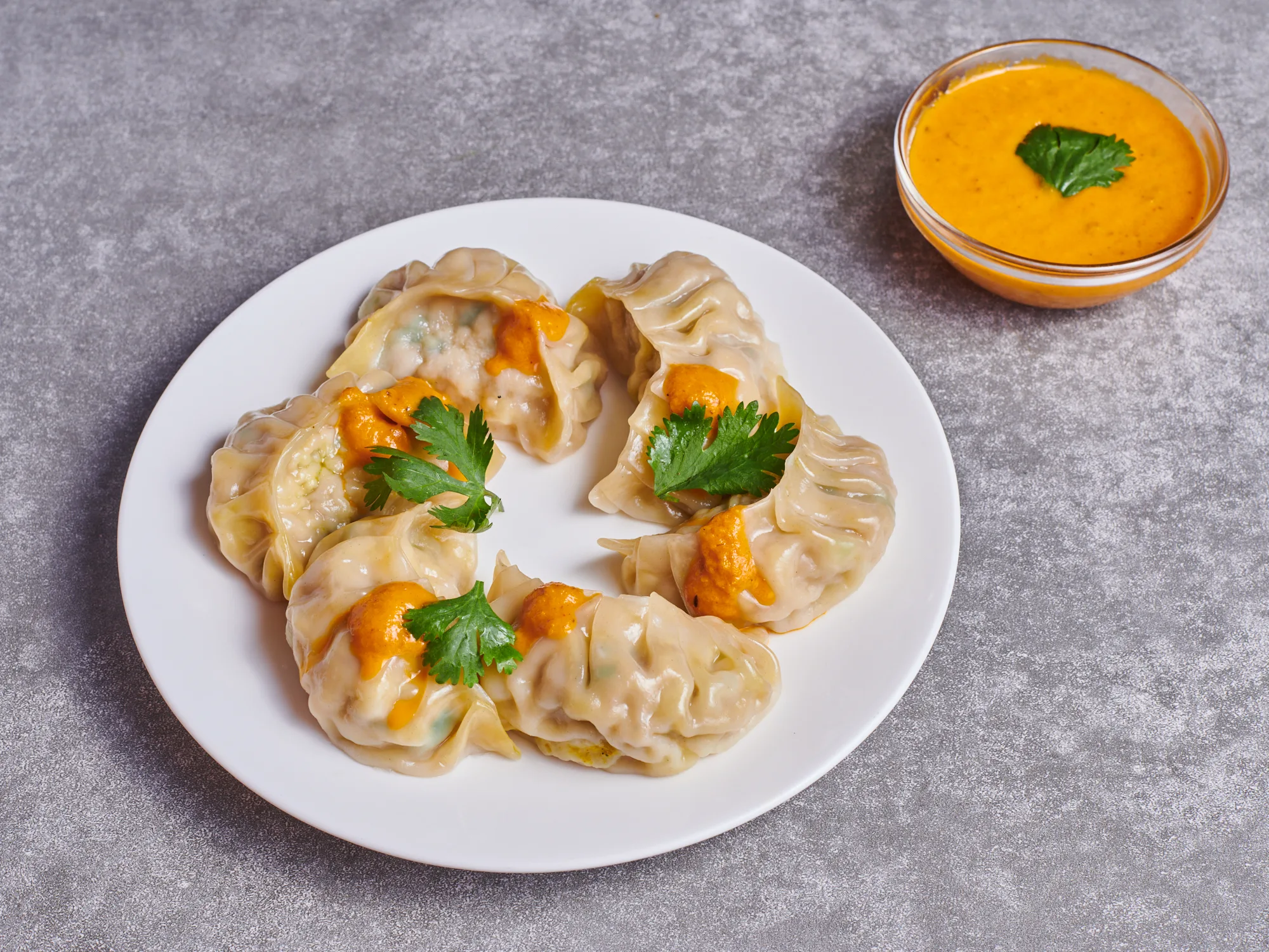 Individual Box Vegan Momo Dumplings with Regular Achaar Sauce (Regular) Individual Box Vegan Momo Dumplings with Regular Achaar Sauce (Regular)