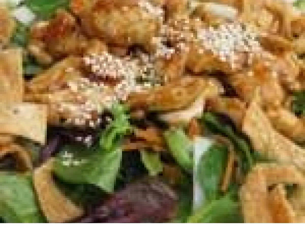 Teriyaki Chicken Salad with Carrots, Wontons, Cashews, and Asian Ginger Dressing.