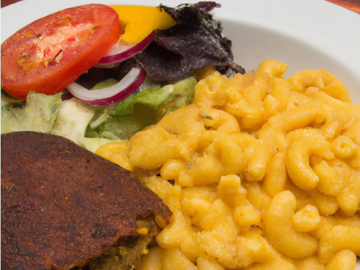 Jamaican Beef Patty Meal served with Mac & Cheese, and a Garden Salad Jamaican Beef Patty Meal served with Mac & Cheese, and a Garden Salad