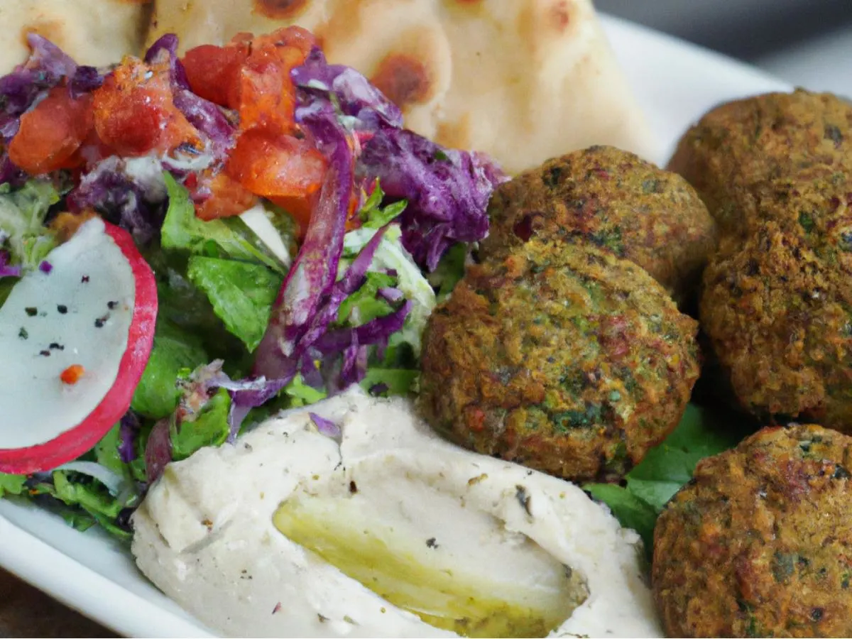 Falafel With Cous Cous, Medditerannean Salad, Hummus and Pita Falafel With Cous Cous, Medditerannean Salad, Hummus and Pita