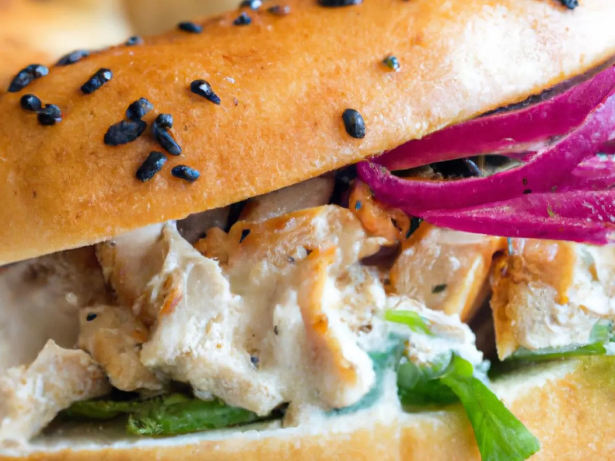 Everything Bagel Saffron Chicken Shwarma Sandwich with Side Salad Everything Bagel Saffron Chicken Shwarma Sandwich with Side Salad