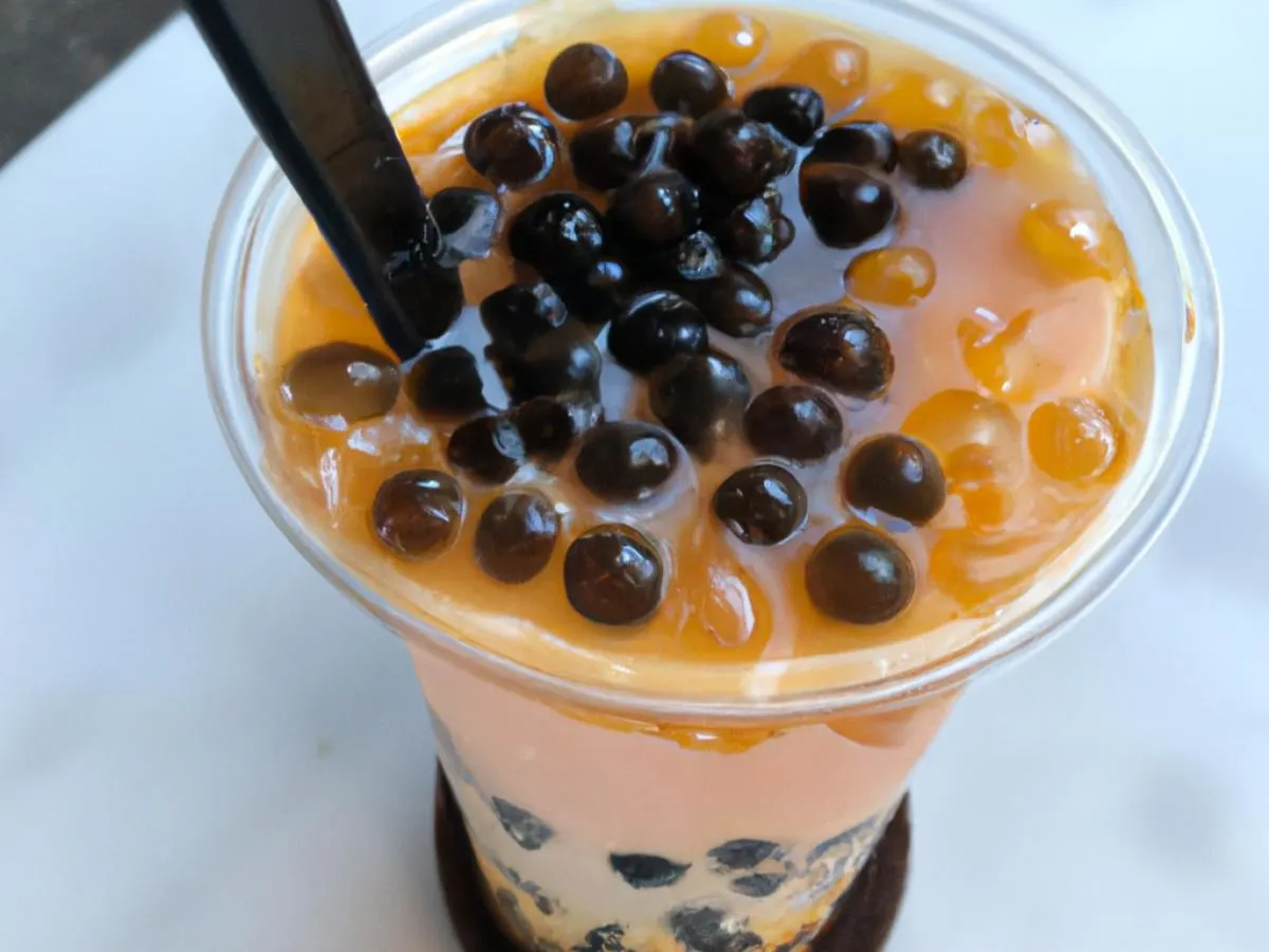 Passionfruit Black Tea with Boba - Half Sweet [24 oz]