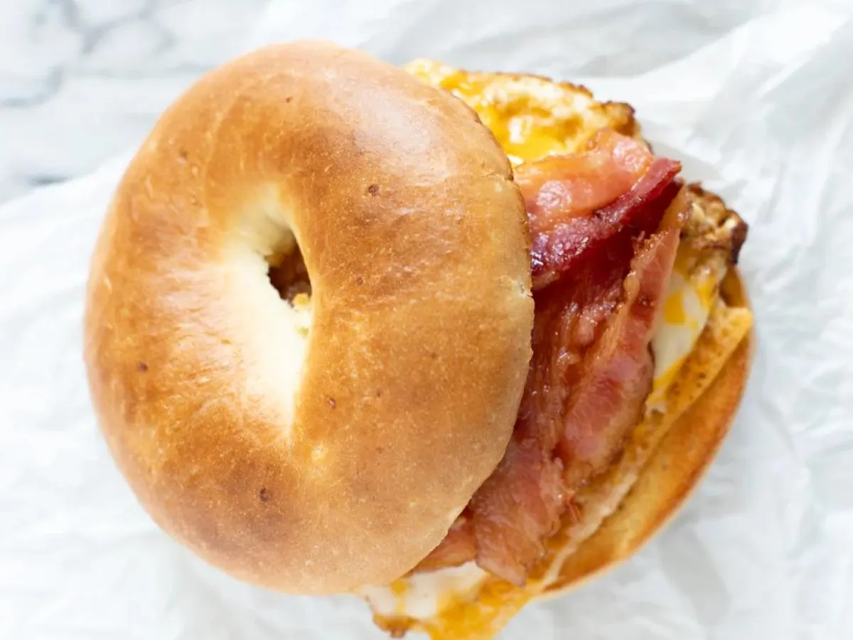 Plain Bagel Tabil Turkey Bacon Sandwich with side salad Plain Bagel Tabil Turkey Bacon Sandwich with side salad