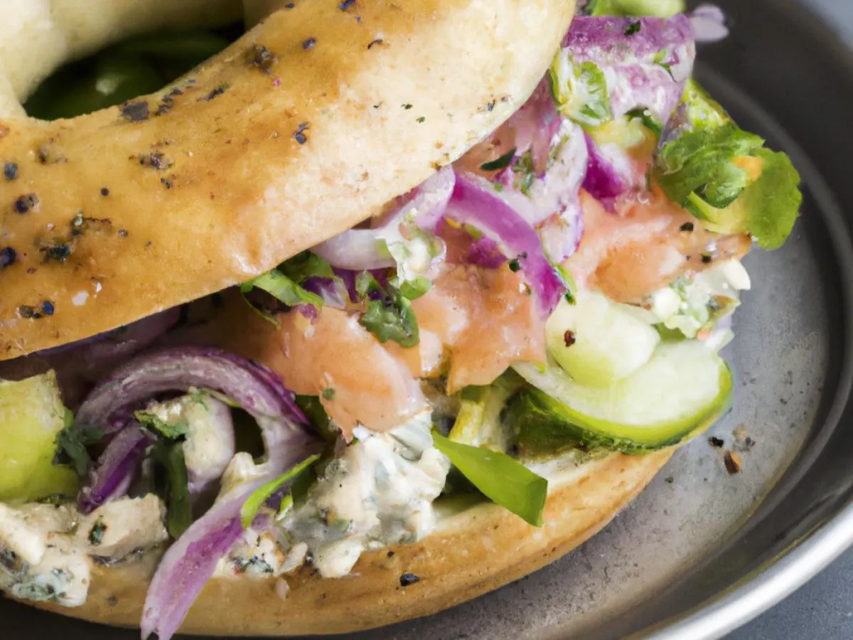 Sesame Seed Bagel Smoked Sockeye Salmon Salad Sandwich with Side Salad and Couscous Salad Sesame Seed Bagel Smoked Sockeye Salmon Salad Sandwich with Side Salad and Couscous Salad