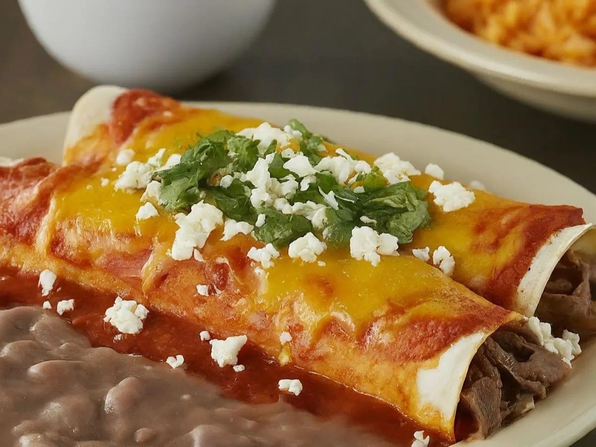 Carne Asada Enchiladas with Refried Beans and Mexican Rice