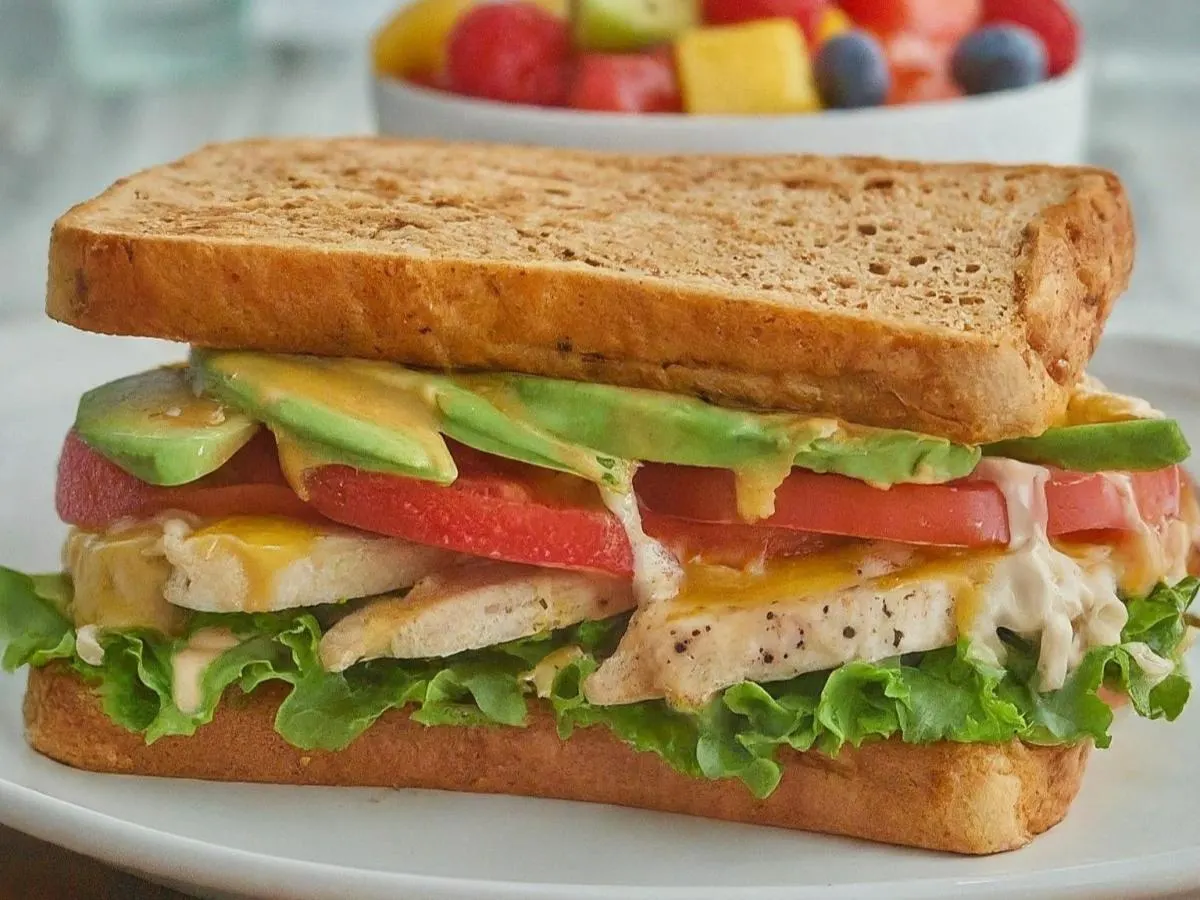 Bella Sandwich on Dutch Crunch With Fruit Salad Bella Sandwich on Dutch Crunch With Fruit Salad
