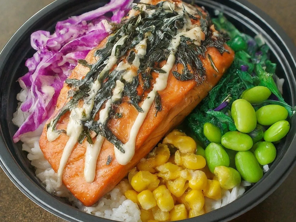 Large Salmon over White Rice with Cucumber, Cabbage, Sweet Corn, Edamame, Seaweed Salad, and Shredded Nori Large Salmon over White Rice with Cucumber, Cabbage, Sweet Corn, Edamame, Seaweed Salad, and Shredded Nori