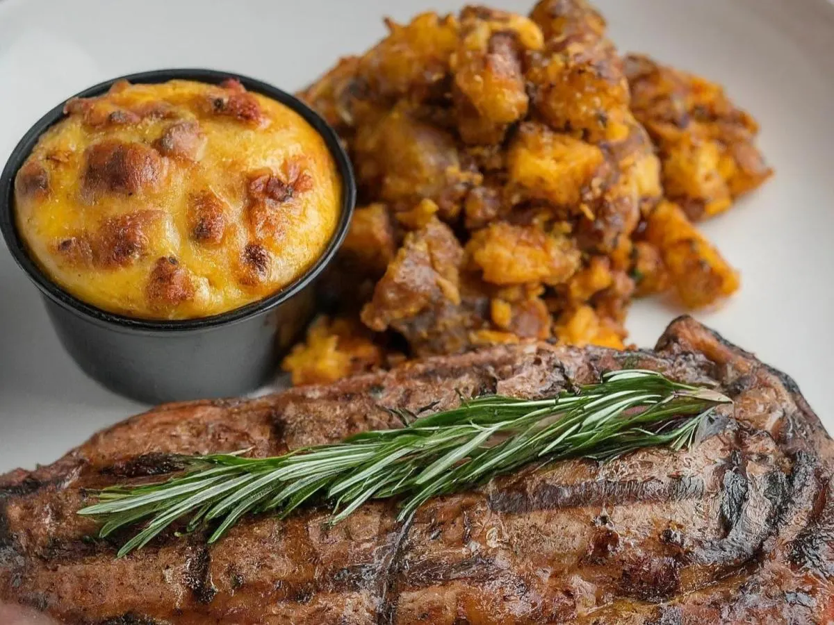 Rosemary NY Strip Steak Served with Crushed Cajun Potato & Sweet Plantain Casserole Rosemary NY Strip Steak Served with Crushed Cajun Potato & Sweet Plantain Casserole